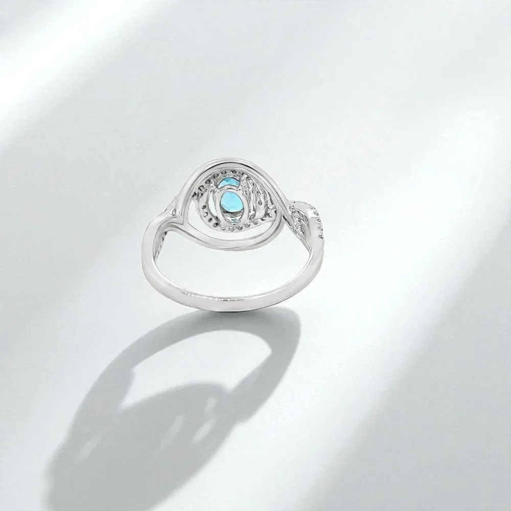 Silver Ring with Bright Blue Gemstone and Halo Accents
